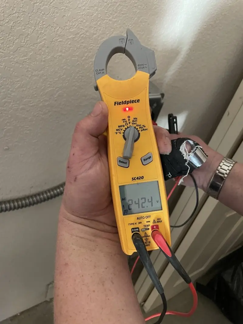 Voltage testing with clamp meter during Recessed Lighting Installation in Harrodsburg